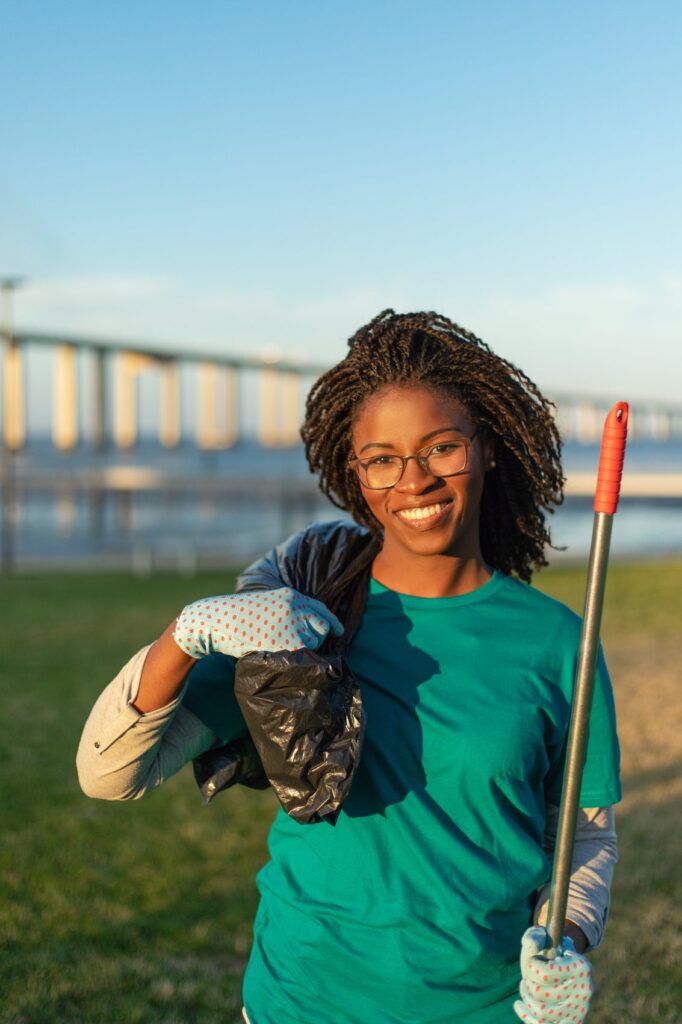 Volunteer holding clean-up bag